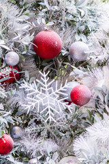 White christmas tree decoration in december./ Every december cool and white christmas tree decoration with colourful bauble, mask, snow man, giftbox.