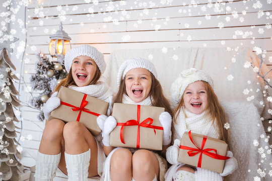 Happy Kids With Gifts In Shocker Christmas Background