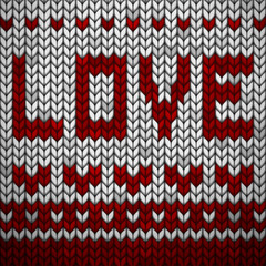 White knitted fabric with a red ornament and inscription LOVE.