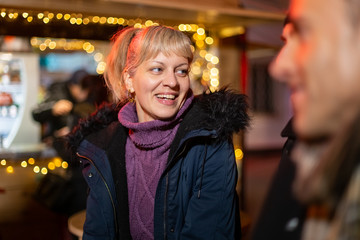 Woman laughing at Christmas market, Zagreb, Croatia.