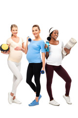 three smiling pregnant women support healthy lifestyle with dumbbells isolated on white