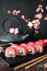 Tuna Sushi Roll with eel, cream cheese Philadelphia and avocado Sushi menu. Japanese food. 