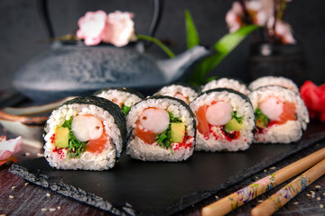 Futomaki with salmon, royal prawn, avocado, chuka, tobacca and cream cheese Philadelphia Sushi menu. Japanese food. 