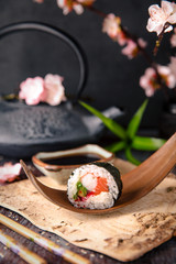 Futomaki with salmon, royal prawn, avocado, chuka, tobacca and cream cheese Philadelphia Sushi menu. Japanese food. 