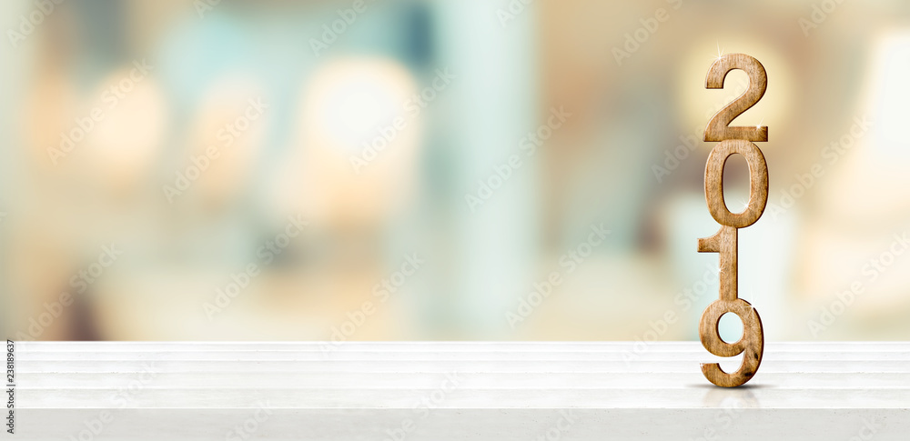 Aufkleber happy new year 2019 on marble table with pale soft bokeh wall,banner for display or montage of produ