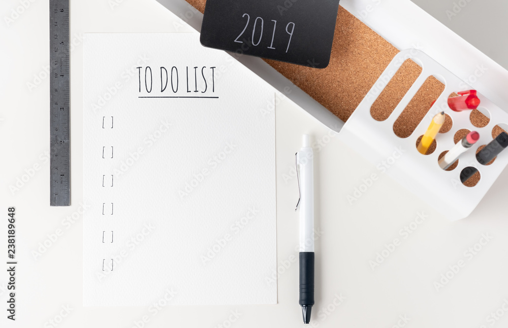 Poster Top view to do list 2019 paper note on modern office stationery on white table.pencil, notepad,ruler,pen and pencil box with plant.Mock up paper note for display of design or content.