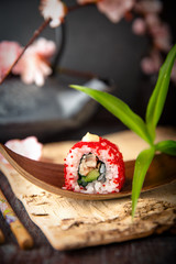Japanese California Roll  with eel, avocado, cucumber, cream with Philadelphia cheese, tobiko caviar and Japanese mayonnaise Sushi menu. Japanese food. 