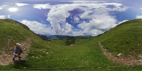 Middle age man hiking in Switzerland mountains at summer, 360 panorama