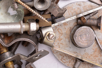 Part of the old mechanism with metal gears, sprockets, chain and other parts covered with rust.