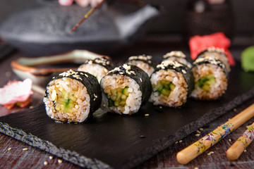 Maki rolls with cucumber and unagi sauce. Sushi menu. Japanese food. 