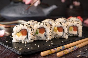 Roll with salmon, avocado, cucumber. Sushi menu. Japanese food. 