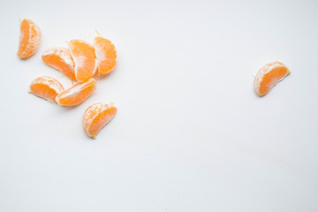 Peeled mandarin on gray background