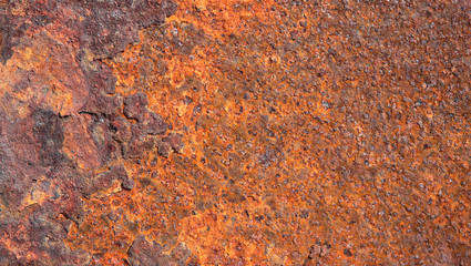 Old grunge rustic iron metal texture background. Colorful orange rough plate.