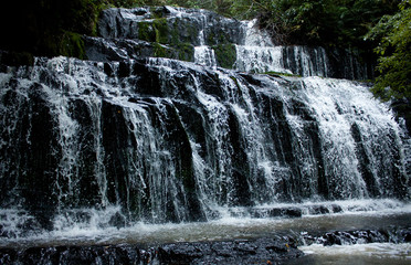 Flowing Purakaunui Falls in the Catlins in the South Island in New Zealand