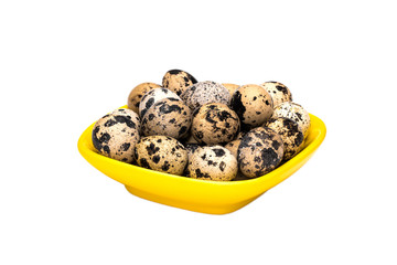Quail eggs in bowl on white background