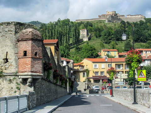 Fototapeta Prats de Mollo la Preste, Pyrenees-Orientales, southern France: Panoramic view of the medieval fortified town with Fort Lagarde and mountains