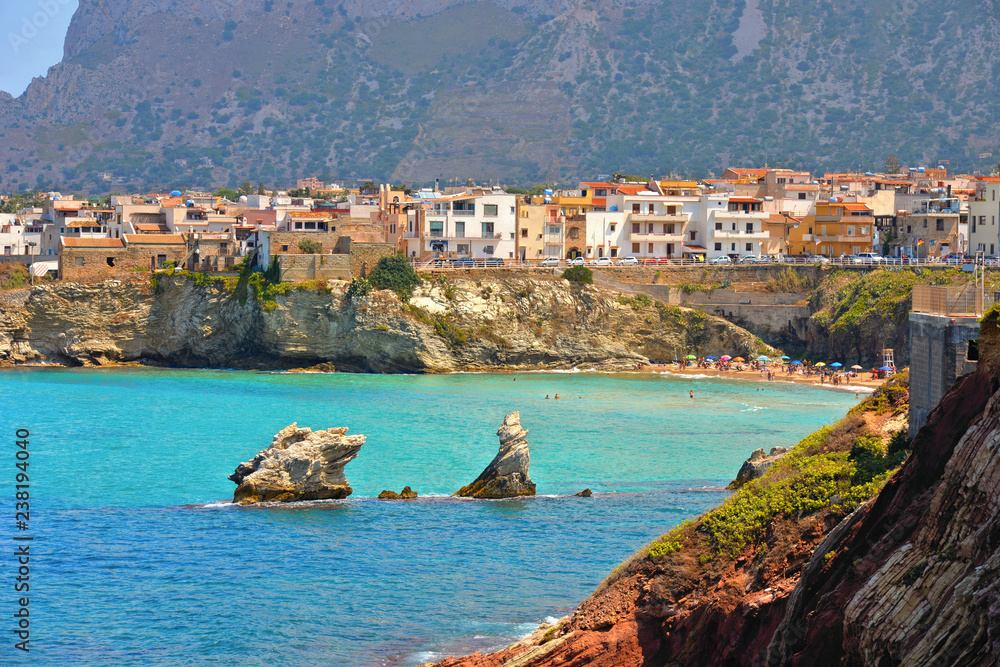 Wall mural beautiful landscape with small coastal town Terrasini and beach calarossa with Faraglioni di Praiola with turquoise blue water and cloudy blue sky with mountains in background, Sicily Italy Palermo