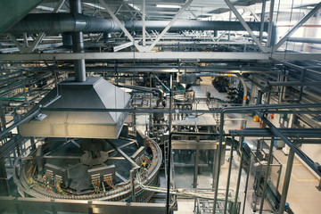 Beer factory with many industrial machines, brewery production manufacturing