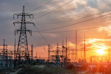 High-voltage power lines. Electricity distribution station. high voltage electric transmission tower. Distribution electric substation with power lines and transformers - Powered by Adobe