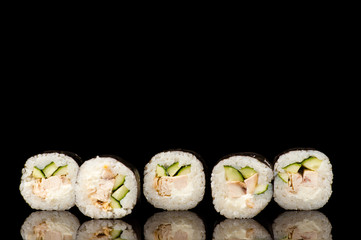 five fresh sushi rolls in reflection 