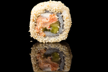 delicious roll with sesame closeup isolated on black background