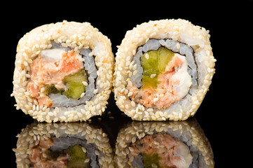 two delicious sushi with sesame closeup 