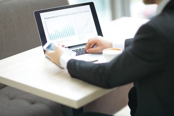 closeup. businessman sitting at a Desk during working hours.