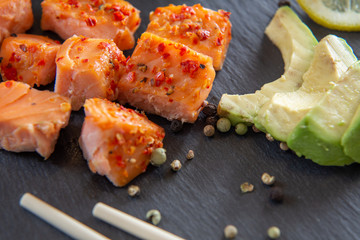 Poke bowls with salad and cucumber on the slate