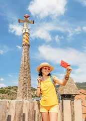 Tourist traveler woman enjoying view of the Bellesguard tower architecture in Barcelona
