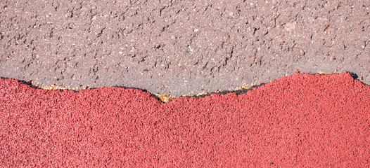 Fototapeta premium Old torn red rubber crumb cover, treadmill or running track surface outdoor playground stadium texture background.