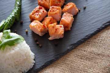 Poke bowls with salad and cucumber on the slate