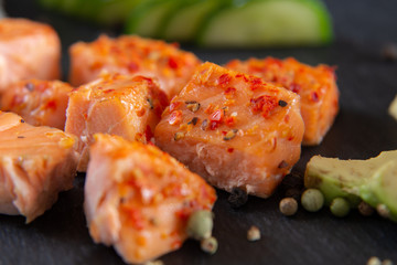 Poke bowls with salad and cucumber on the slate
