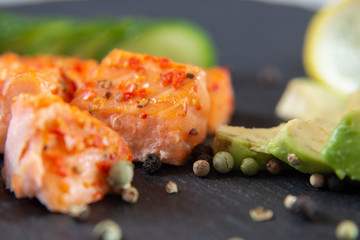 Poke bowls with salad and cucumber on the slate