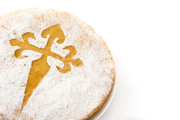 Tarta de Santiago. Traditional almond cake from Santiago in Spain, isolated on white background