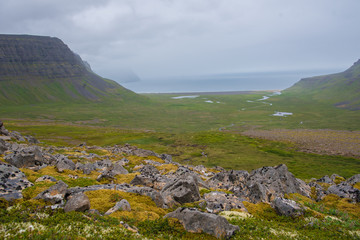 Fototapeta na wymiar Landscape view with mountains and coastline from an overlook on Hornstrandir Peninsula, Iceland