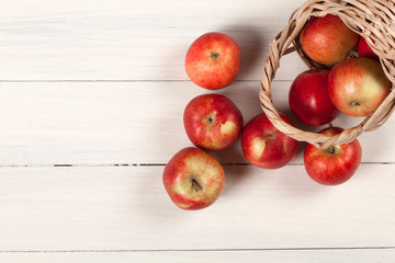 apple basket over wooden table