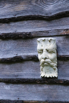 Green Man Sculpture On Old Barn Wood