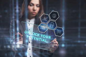 The concept of business, technology, the Internet and the network. A young entrepreneur working on a virtual screen of the future and sees the inscription: Unlock your potential