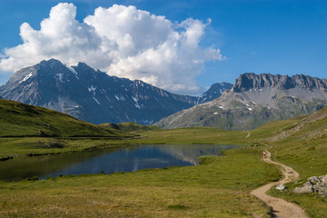 Fototapeta na wymiar Summer view of the lake Plan at the base of mount Grande Casse. France, Savoie, Parc National de la Vanoise (National park of Vanoise). Photo taken July 2018.