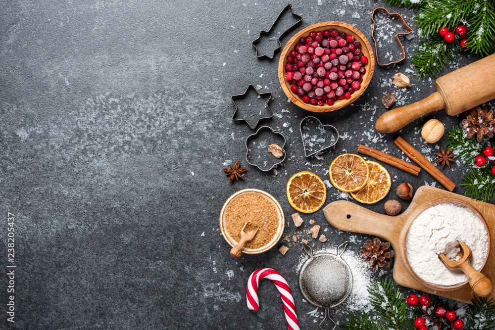 Wall mural christmas background. table for holiday baking cookies with ingredients