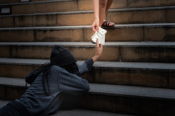 Beggars, Homeless people Lie on the steps, ask for a fraction of money from people travelng to buy...