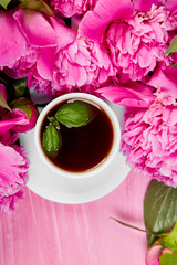 Obraz na płótnie Canvas Bouquet Peony flowers and cup of coffee