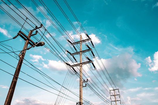 High voltage electricity pylon for electric supply transmission with blue sky, Power distribution technology and generator infracstructure equipment 