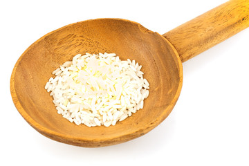 Large wooden spoon with rice isolated on white