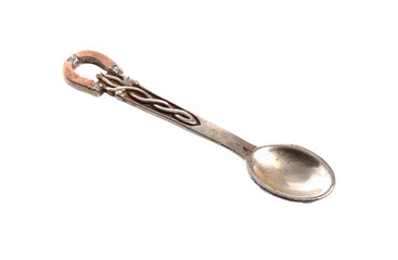 Petit silver jewelery spoon isolated on white background