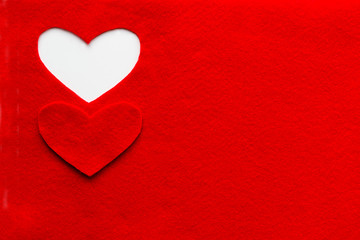 Obraz premium Heart carved in red felt. Background for design to Valentine's Day.