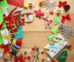 Christmas gifts and felt toys on a wooden wooden table
