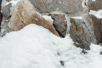 snow on the stone wall