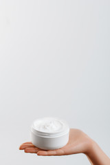 Hand Skin Care. Close Up Of Female Hands Holding Cream Tube, Woman Hands With Natural Manicure Nails Applying Cosmetic Hand Cream On Soft Silky Healthy Skin. Beauty And Body Care Concept