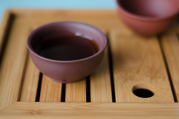 A Cup of tea close-up on a wooden table.